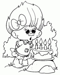 A small Troll blows on its four candles